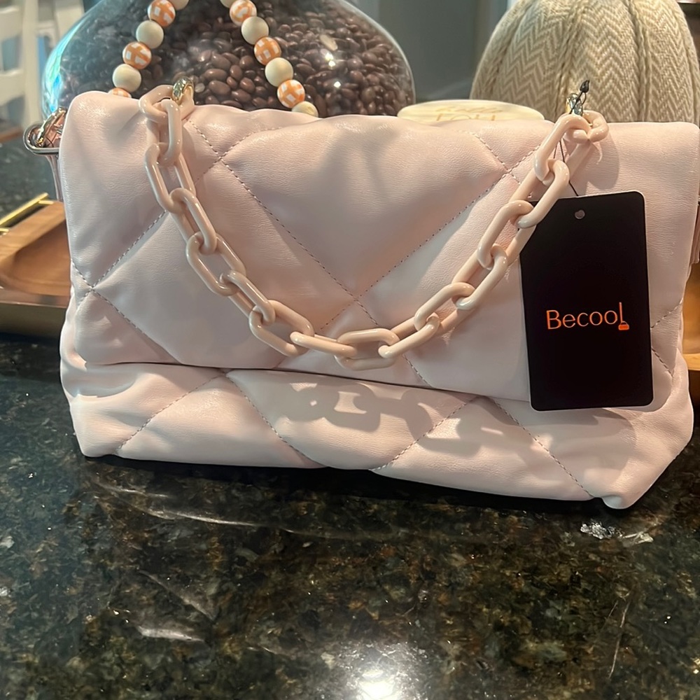 Puffy crossbody in beautiful pink nude faux leather. Never used.